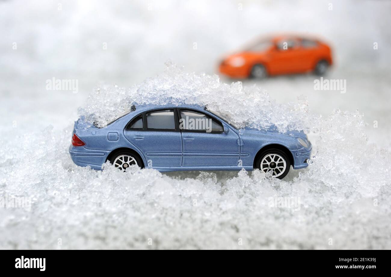 MODEL CAR IN ICY CONDITIONS RE WINTER MOTORING WEATHER ICE ETC UK Stock Photo