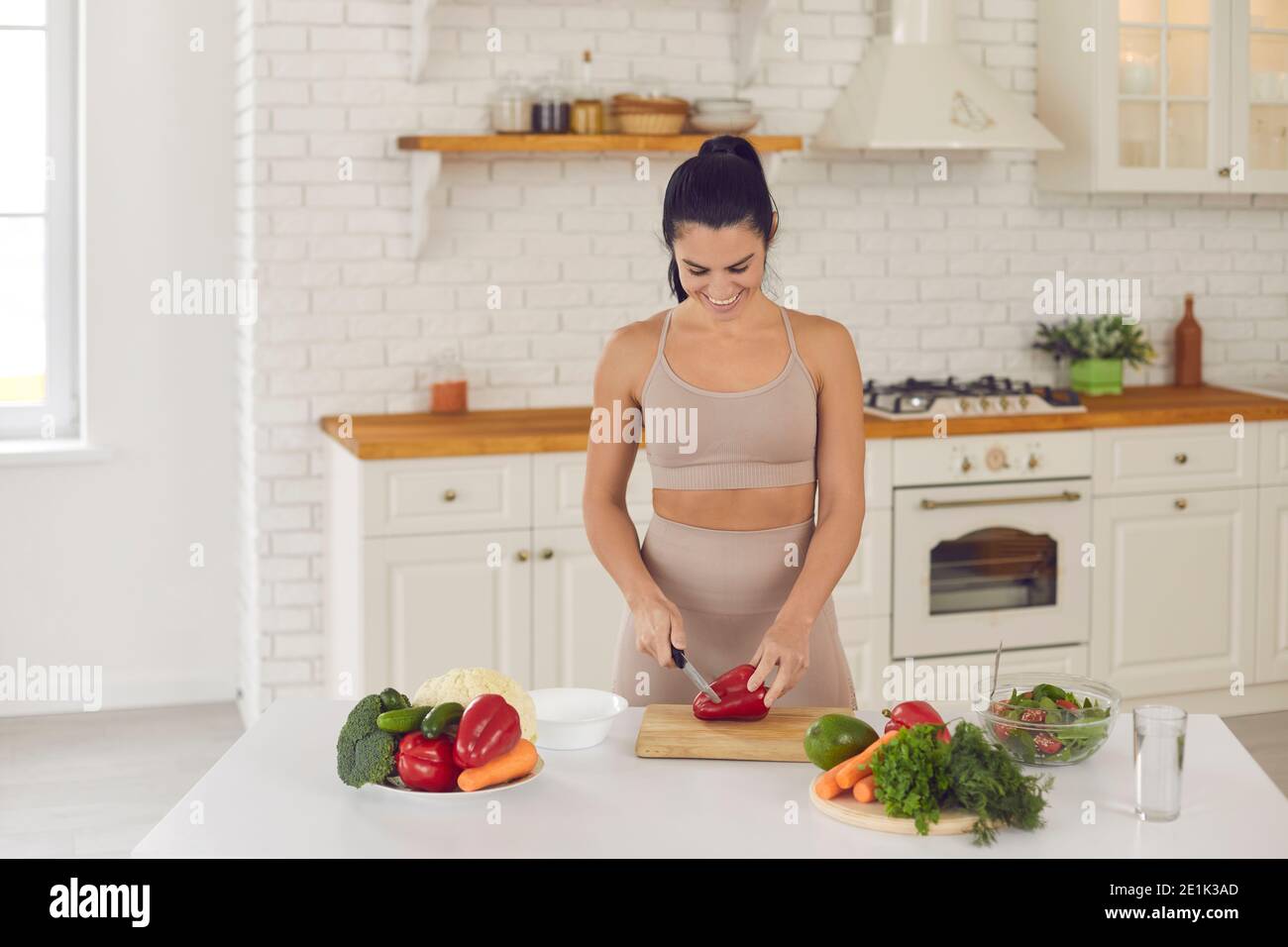 Sports woman records a video for her blog and teaches how to properly prepare healthy natural food. Stock Photo