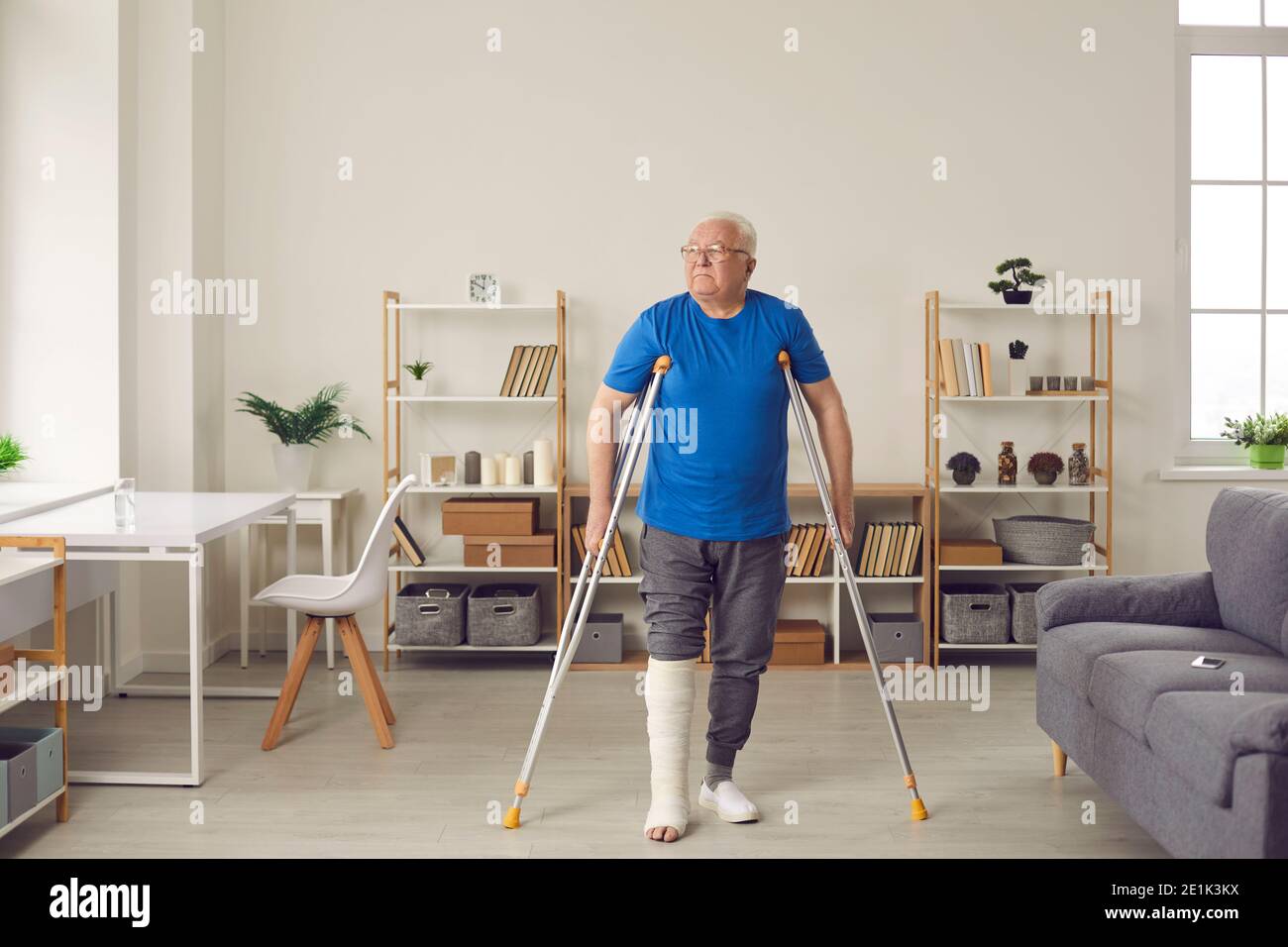 Senior man with broken leg makes good progress and walks with crutches