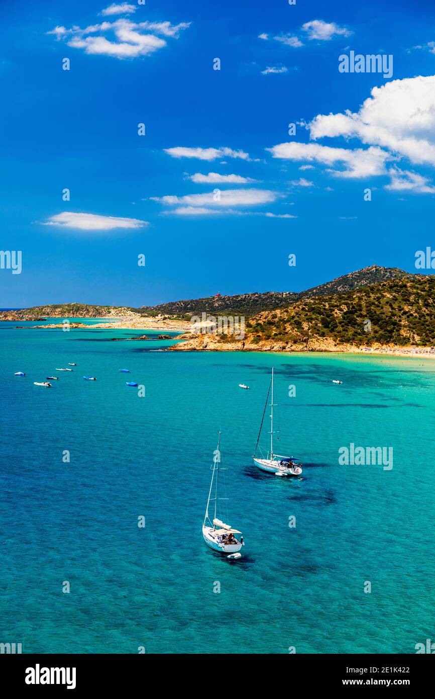Aerial view of anchored sailing yacht in emerald sea. Aerial view of a