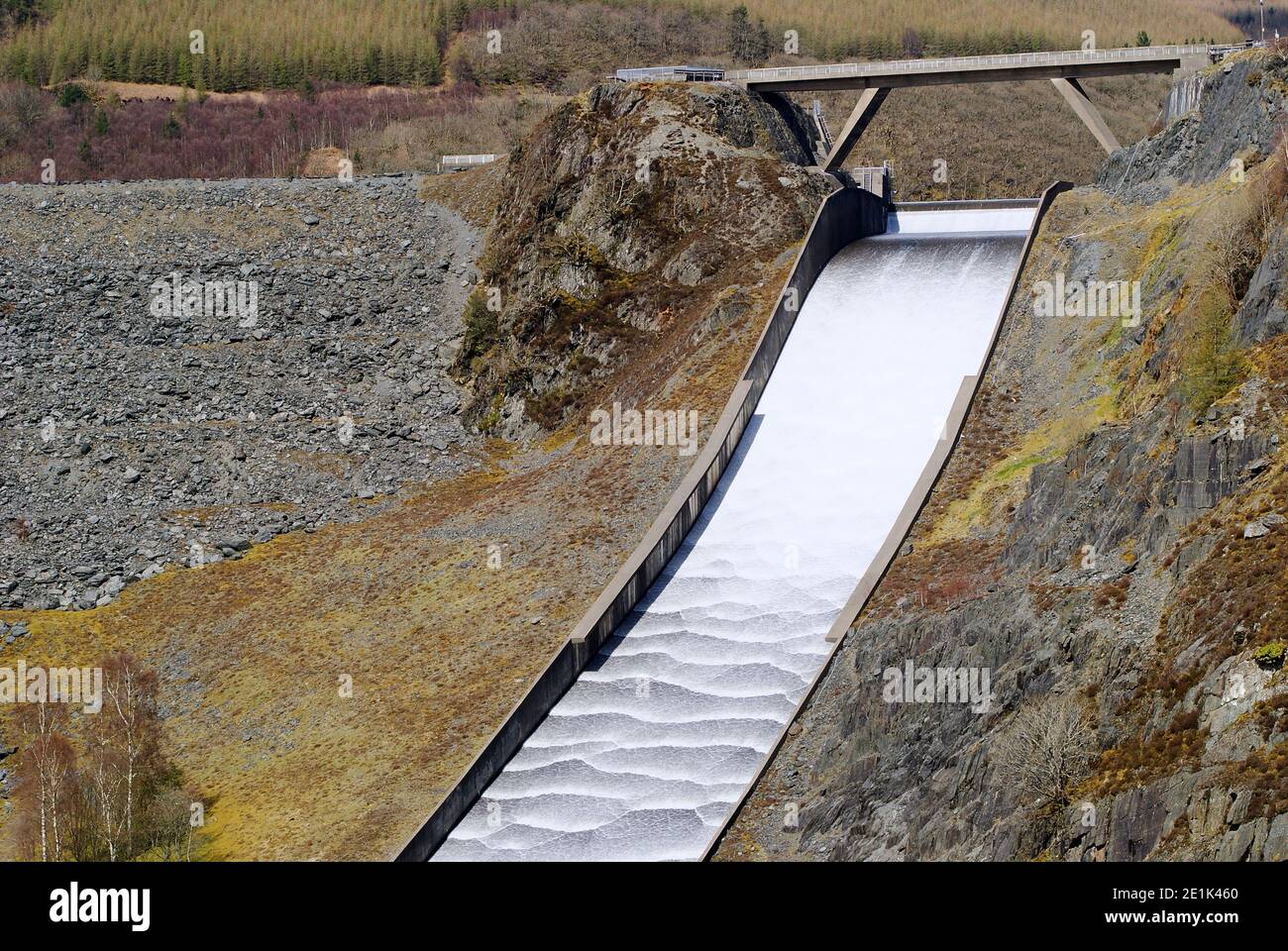 Silvery fast flowing water spill from reservoir Stock Photo