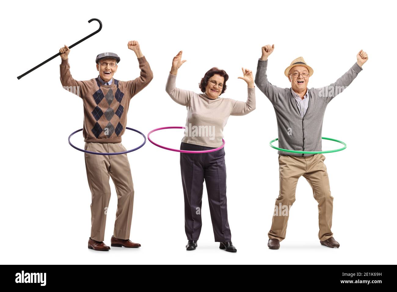 Happy elderly people spinning hula hoops isolated on white background Stock Photo