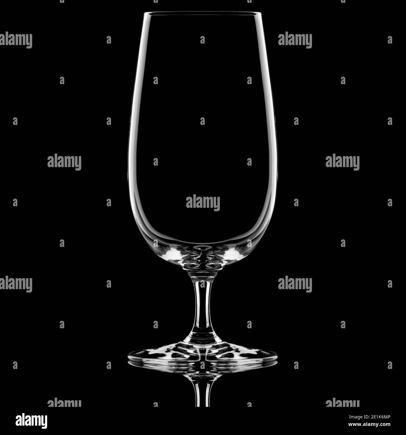 Empty stemmed beer glass on black background Stock Photo