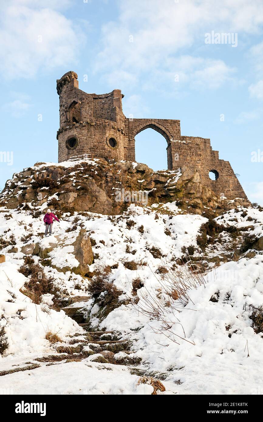 Mow Cop castle, the folly of a ruined castle in snow during winter