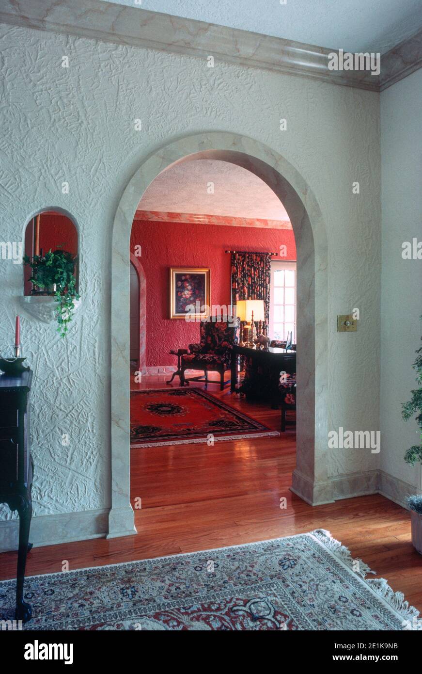 1992 luxury suburban house features and arched doorway and hardwood floors, USA Stock Photo