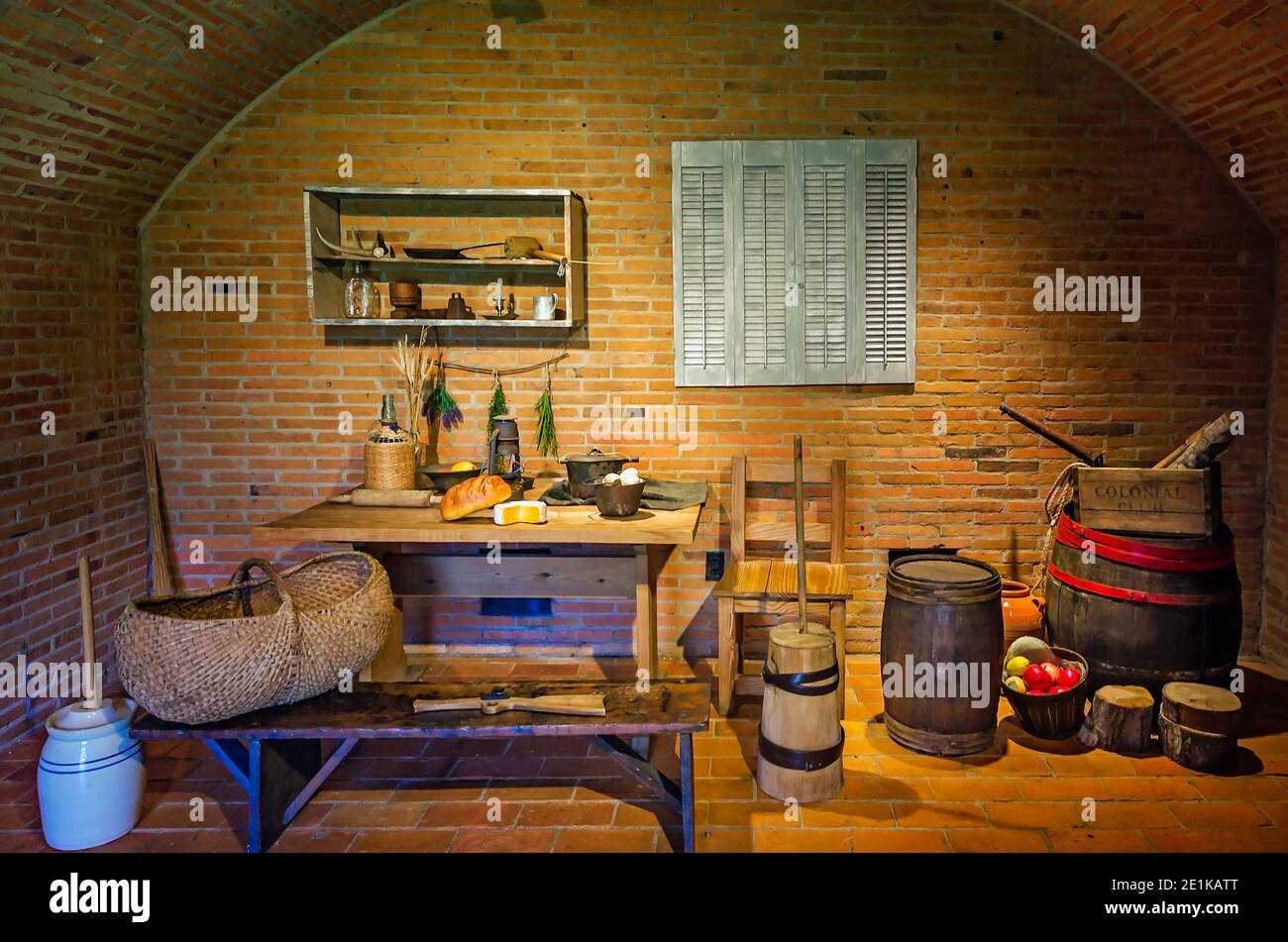 Typical Colonial kitchen items are set up in a room depicting daily life of Colonial settlers at the Fort of Colonial Mobile in Mobile, Alabama. Stock Photo