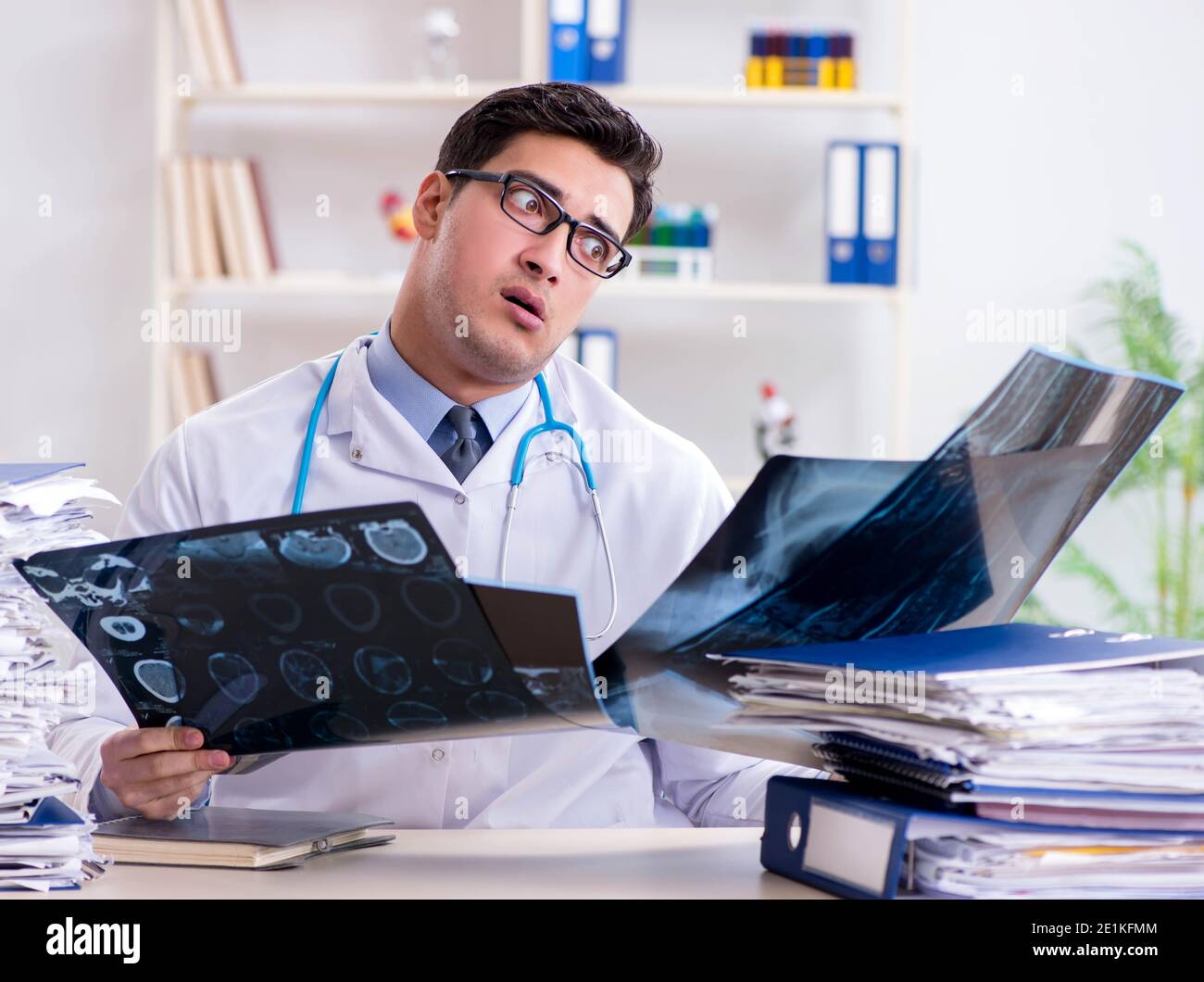 The tired radiologist with xray image in hospital Stock Photo Alamy