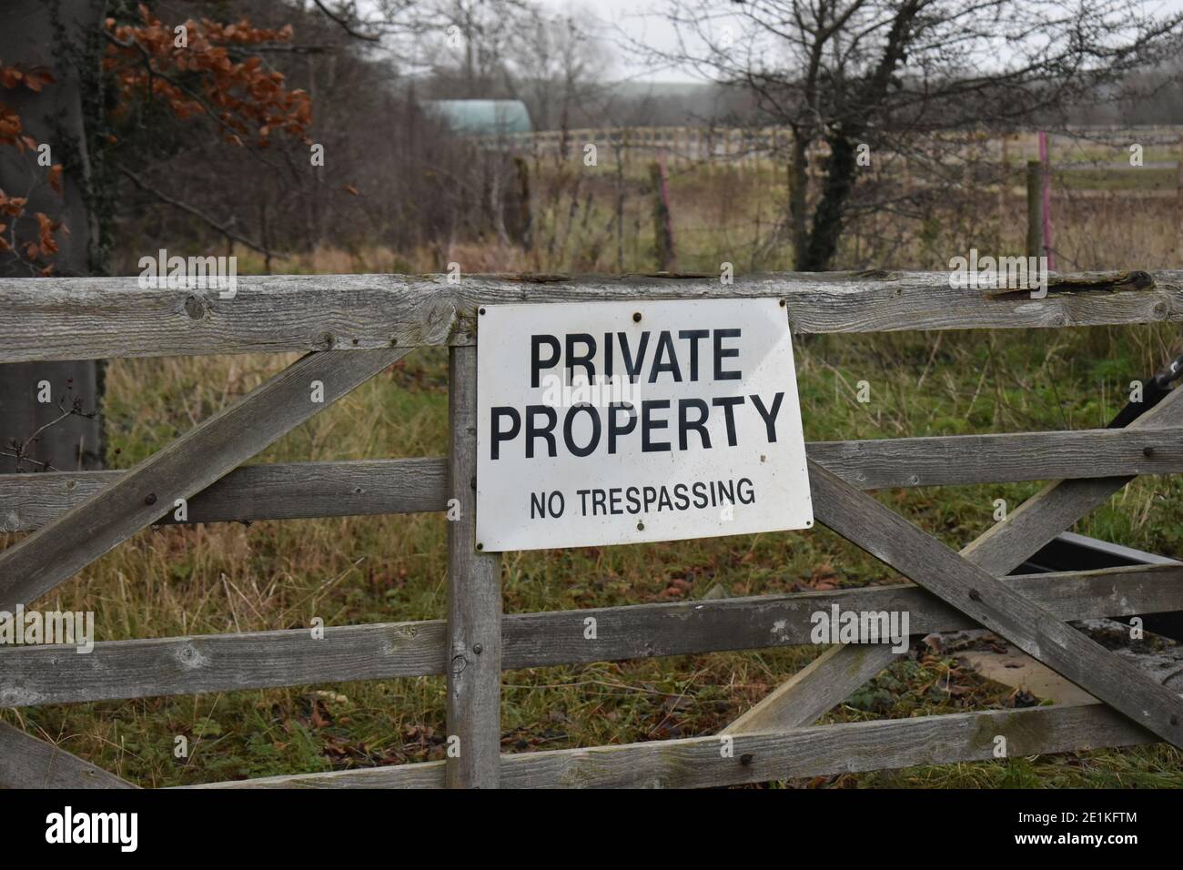 Sign on gate: Private Property No Trespassing. Stock Photo