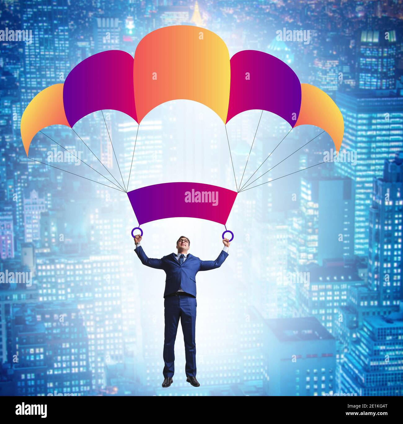 The young businessman falling on parachute in business concept Stock