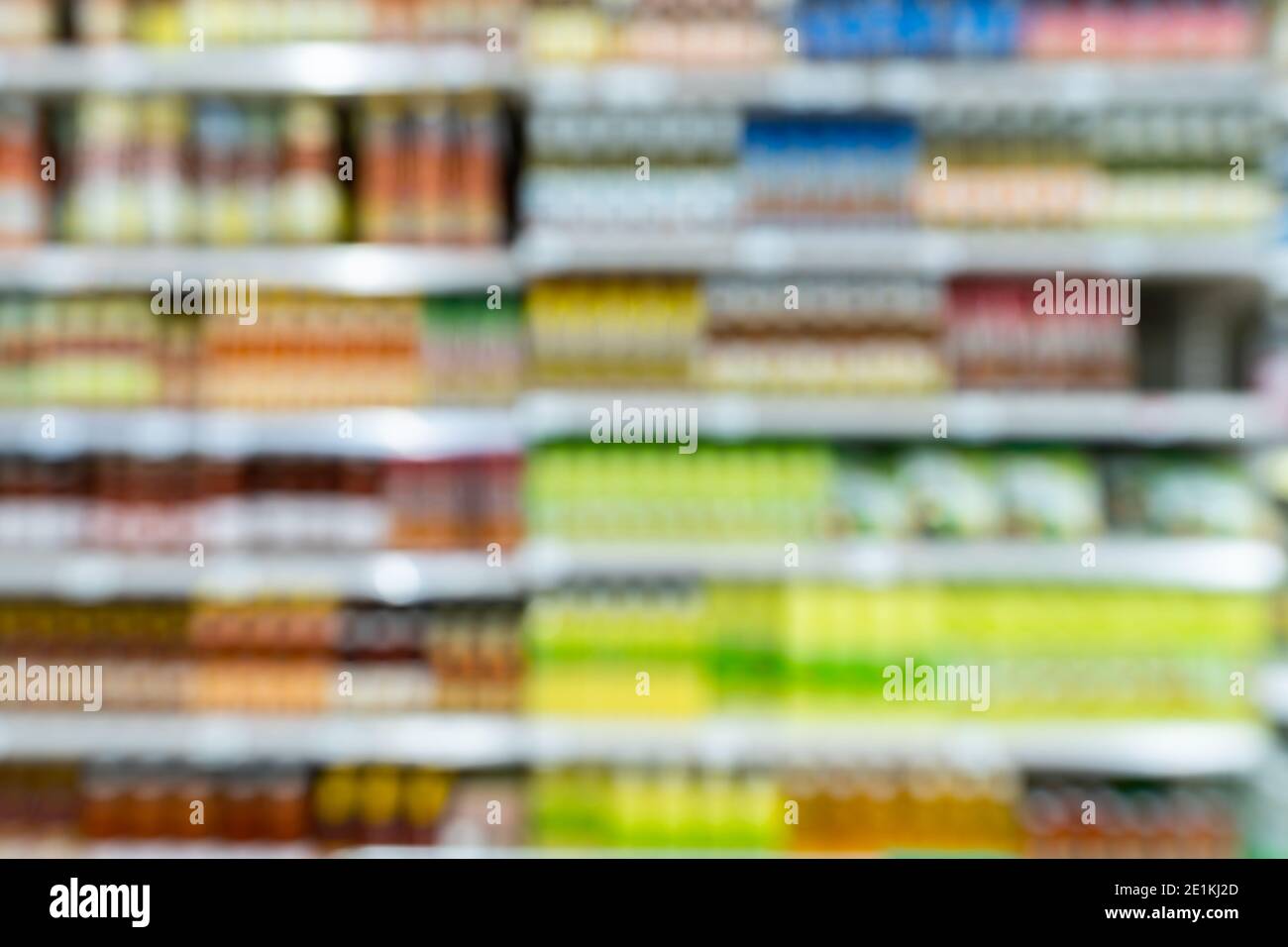 Blur image of shelf with consumer product shop in supermarket Stock Photo