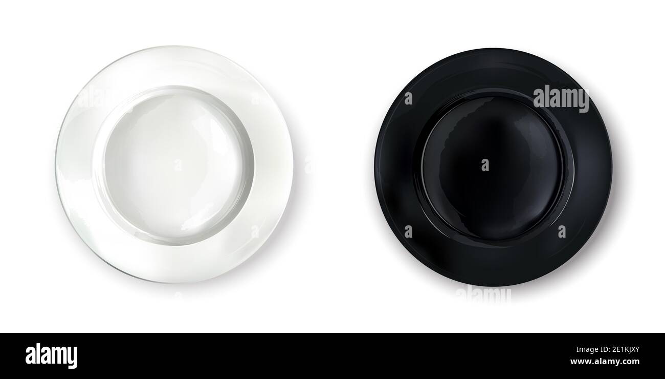 Two empty round plates - white and black Stock Photo - Alamy