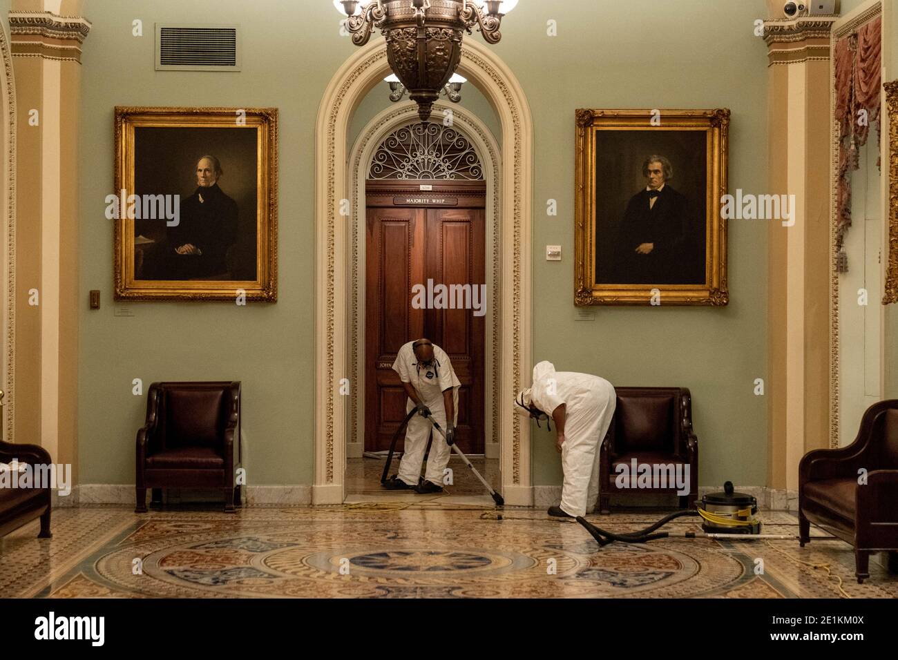 Washington, United States. 07th Jan, 2021. Workers clean the halls near the Senate Chambers of the U.S. Capitol in Washington, DC on Wednesday, January 7, 2021. Pro-Trump rioters breached the security perimeter Jan 6 and penetrated the U.S. Capitol to protest against the Electoral College vote count that would certify President-elect Joe Biden as the winner. Photo by Ken Cedeno/UPI Credit: UPI/Alamy Live News Stock Photo