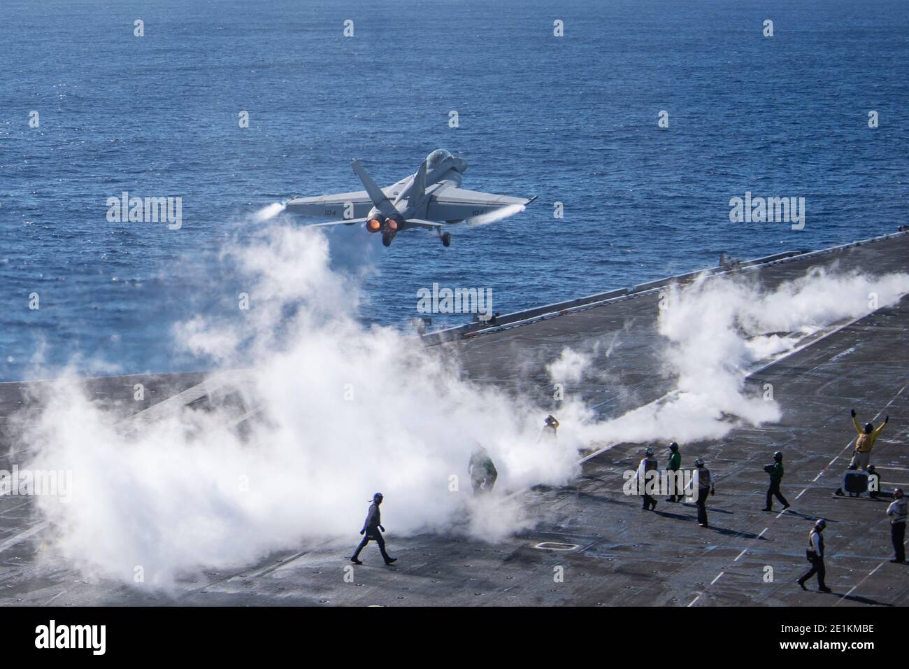 A U.S. Navy F/A-18F Super Hornet fighter aircraft, assigned to the Black Knights of Strike Fighter Squadron 154, lands on the flight deck of the Nimitz-class aircraft carrier USS Theodore Roosevelt during operations January 6, 2021 in the Pacific Ocean. Stock Photo