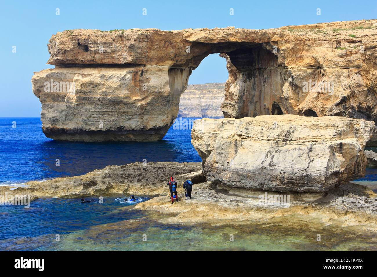 Scuba divers coming up afte a dive around the Azure Window on the Island of Gozo in Malta Stock Photo