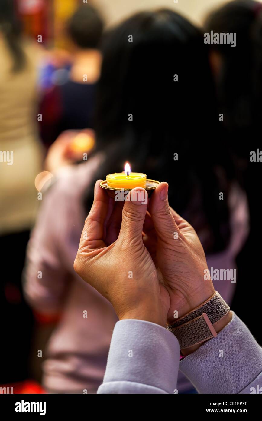 People holding small candle holders in the blessing Stock Photo Alamy