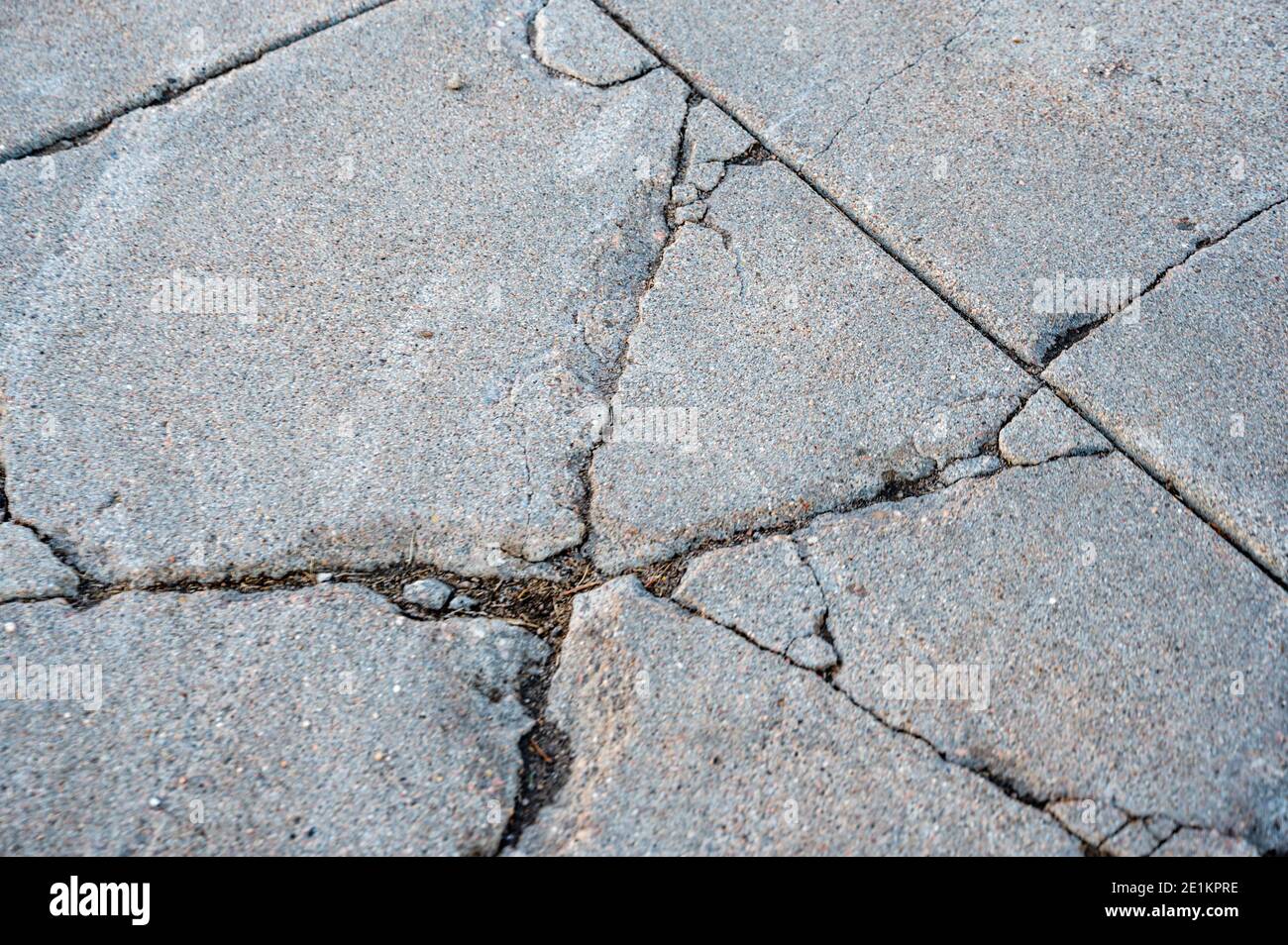 damaged concrete slabs caused by soil structure heave Stock Photo Alamy