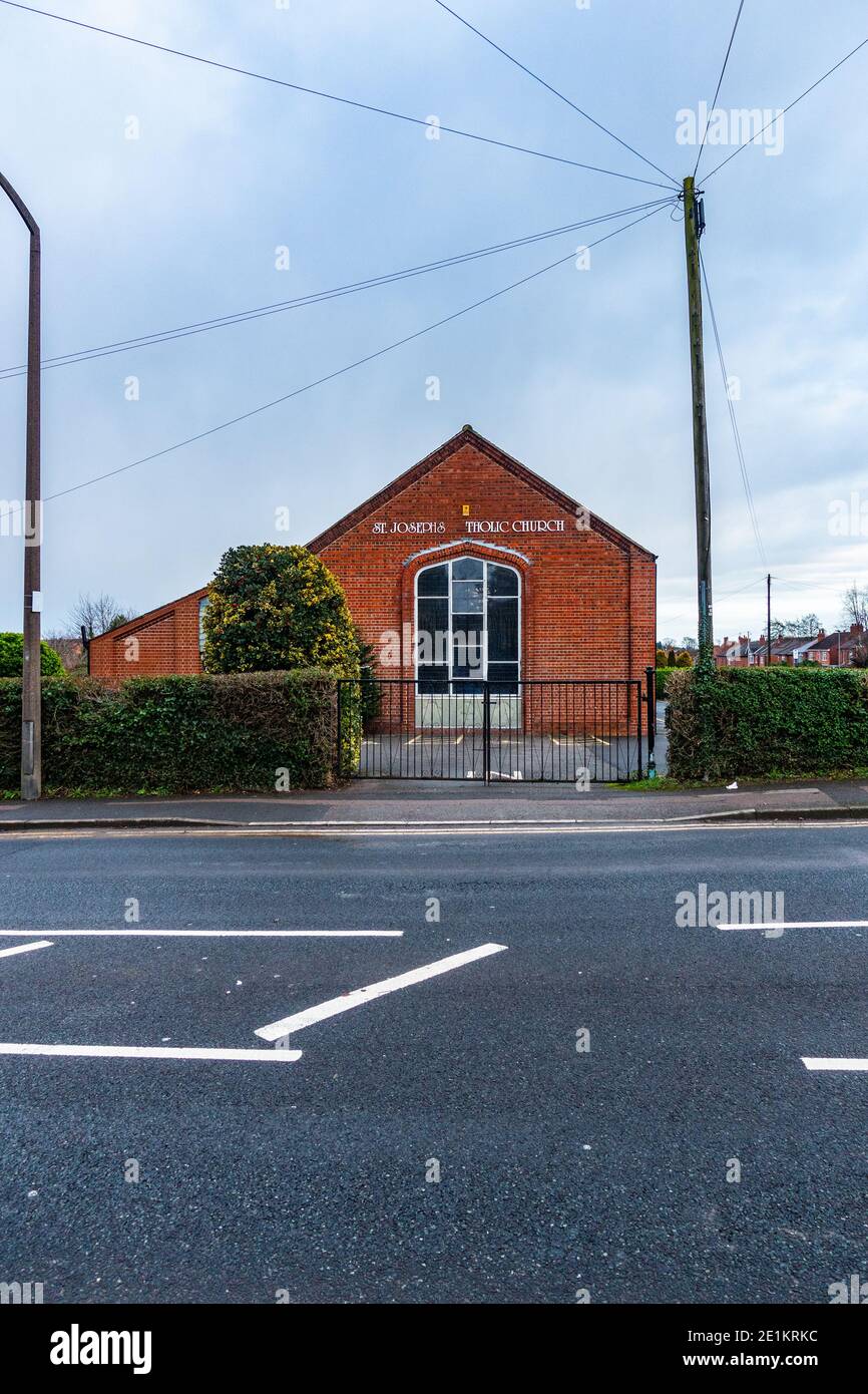 St Josephs Catholic Church Dinnington with letters missing off sign Stock Photo