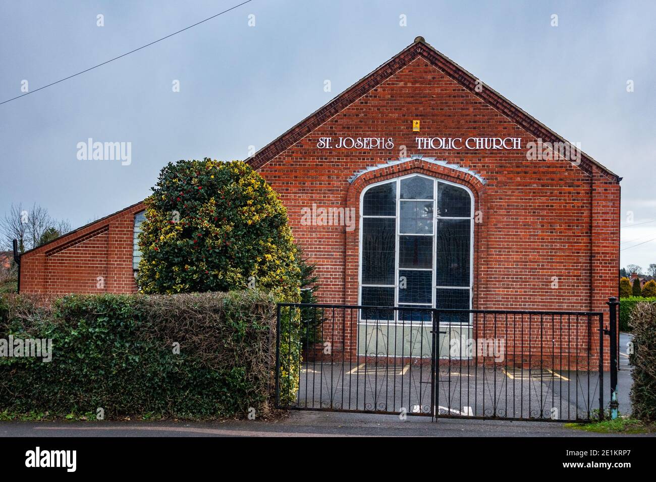 St Josephs Catholic Church Dinnington with letters missing off sign Stock Photo