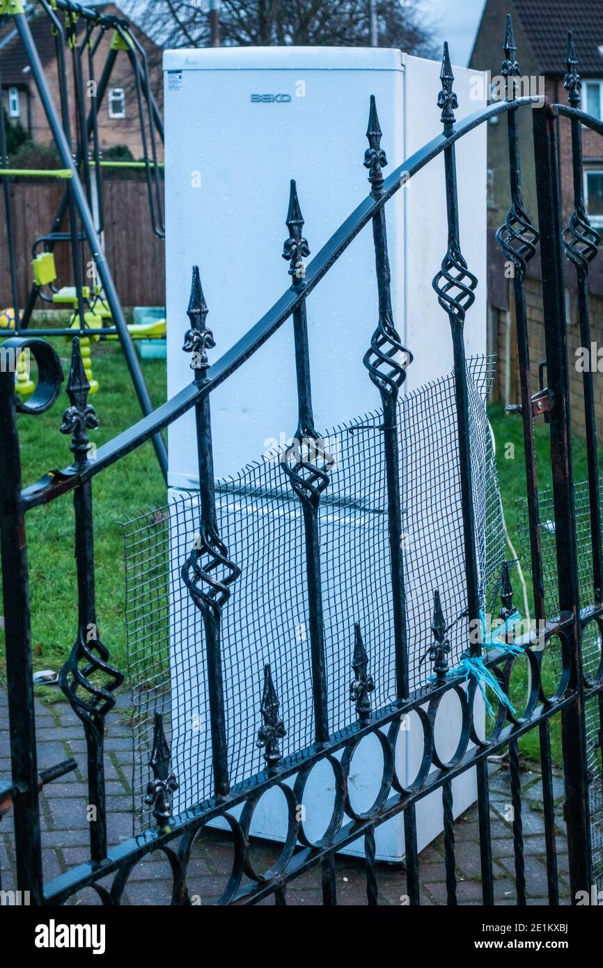 Old fridge freezer and fridge left in the front garden for recycle van
