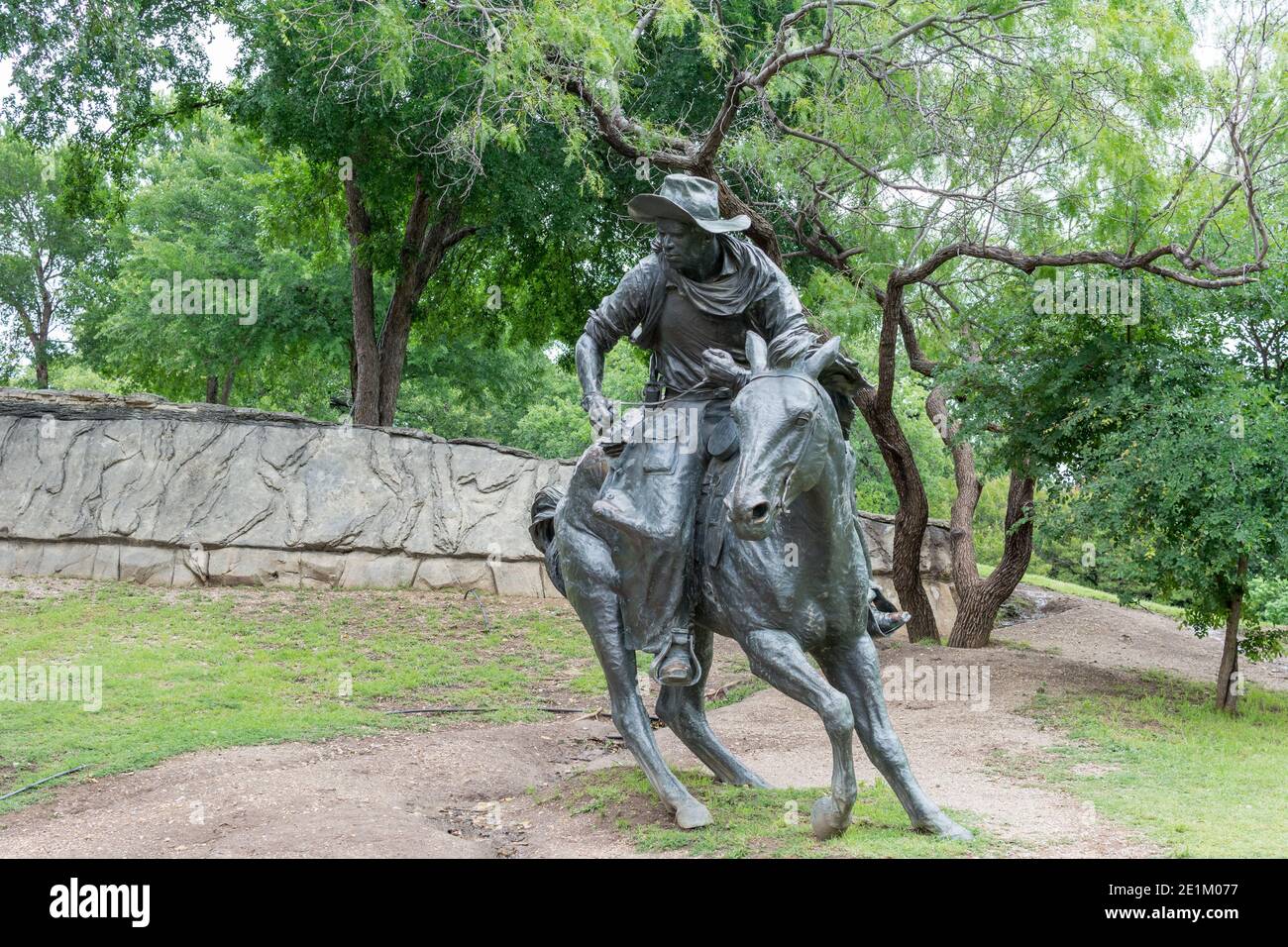 statue of cowboy riding a horse at the Pioneer Plaza in Dallas, Texas