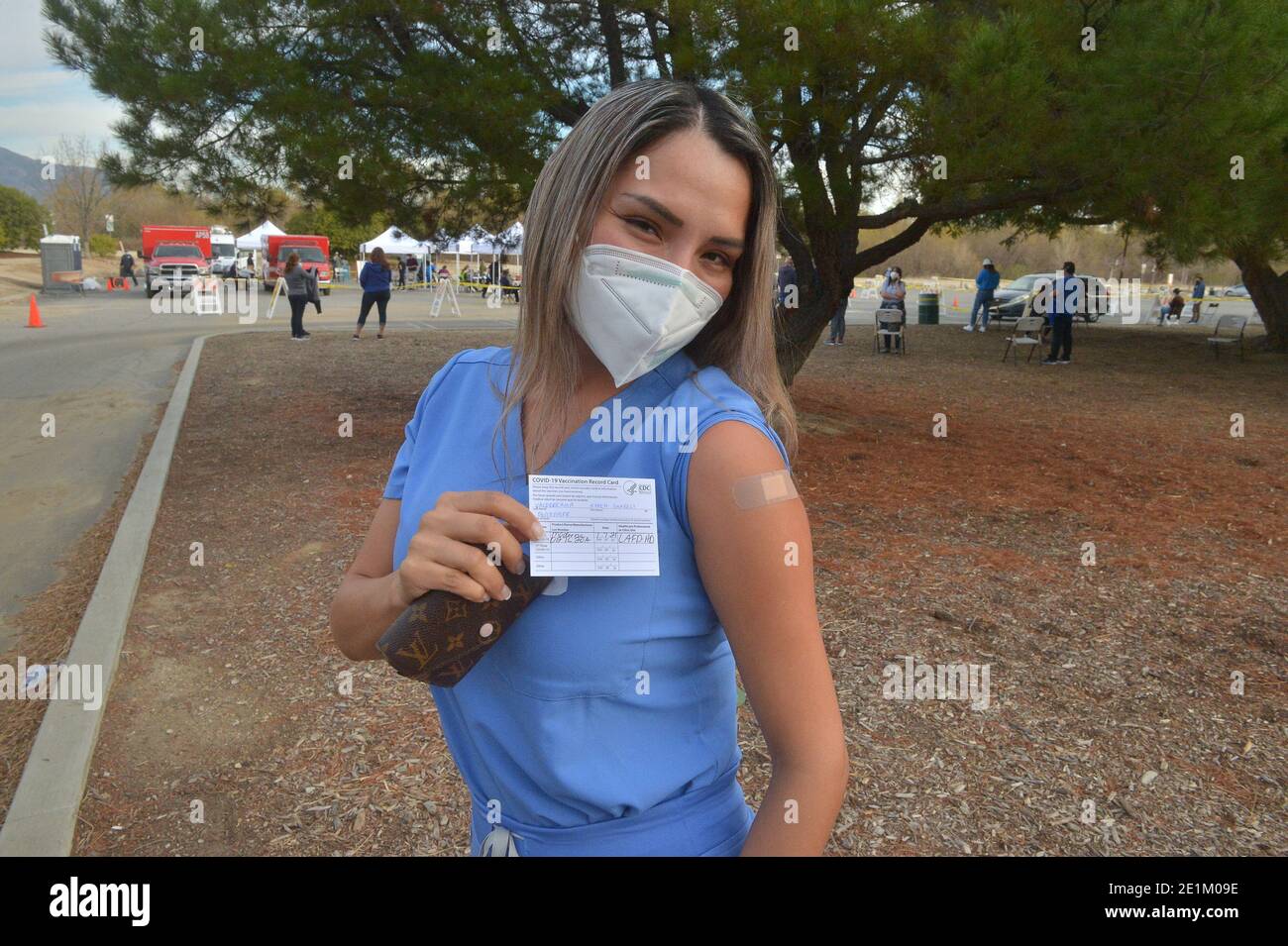 Los Angeles, United States. 07th Jan, 2021. Dental technician Karen Valderrama displays her COVID-19 vaccination card at the Hansen Dam vaccination site in Los Angeles on Thursday, January 7, 2021. The Los Angeles Times reported that sites have been met with crowds of non-healthcare workers trying to get the vaccine, and that about 100 people were given vaccines without showing proof that they worked in the healthcare industry. Photo by Jim Ruymen/UPI Credit: UPI/Alamy Live News Stock Photo