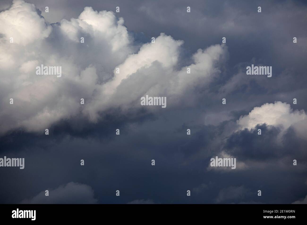 Dark cloudy sky. Overcast sky before rain. Large dark blue storm clouds Stock Photo