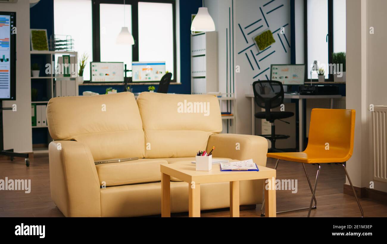 Empty start up business office with modern design and confortable couch. Financial company with nobody in it, place of work startup, workplace indoors concept Stock Photo