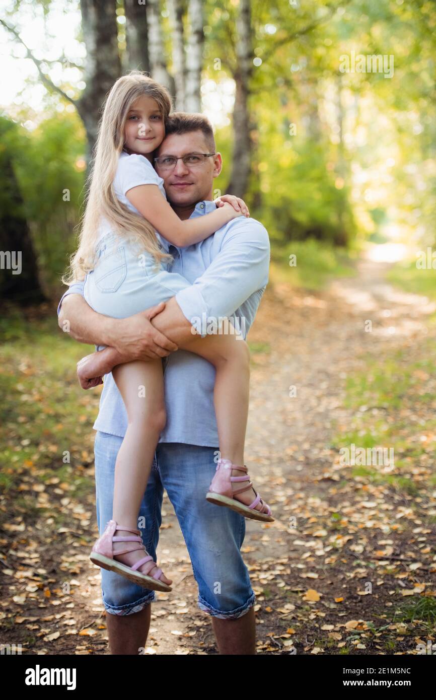 A father and daughter in forest on a meadow Stock Photo - Alamy