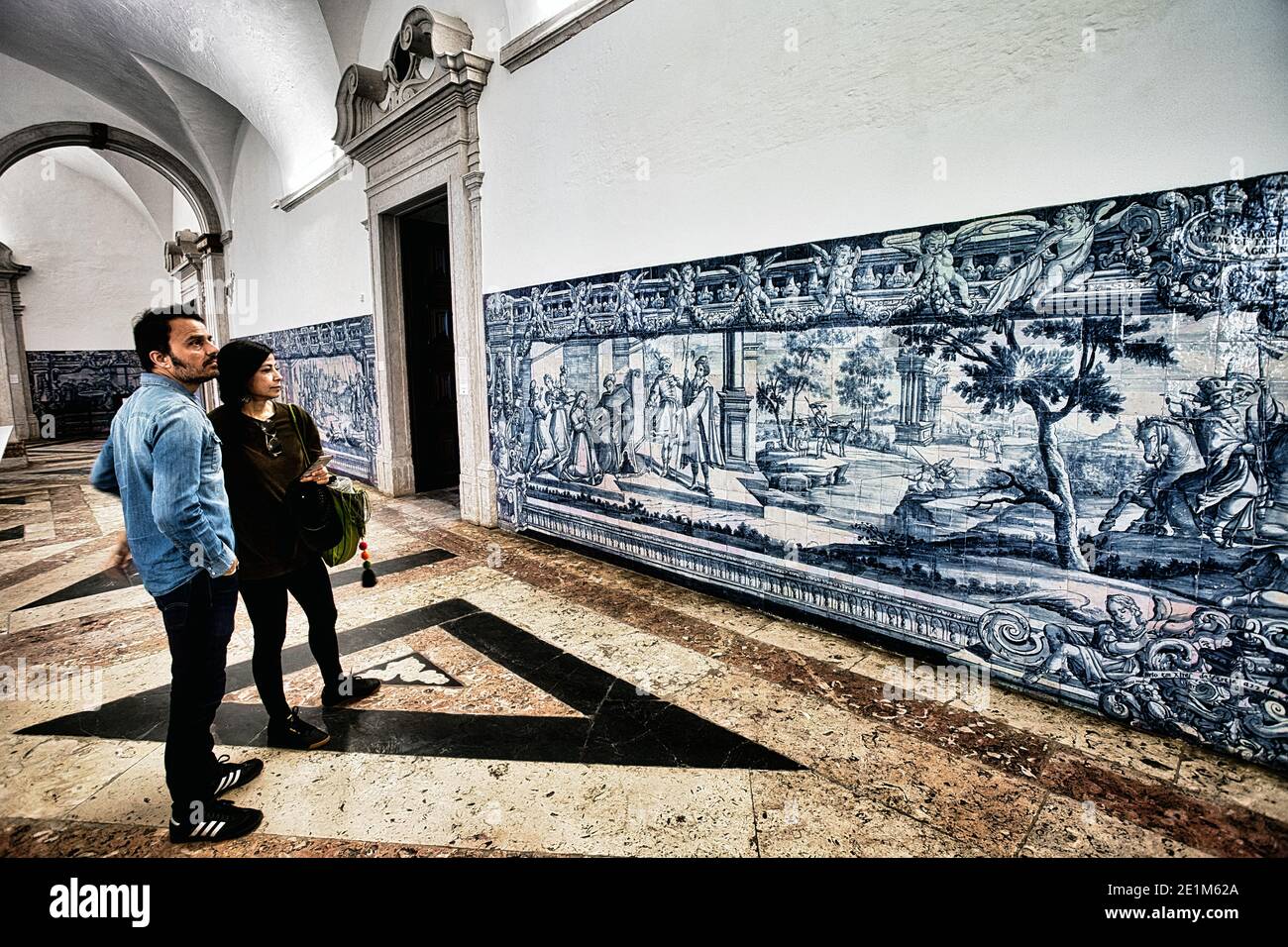 PORTUGAL / Lisbon / Tourists looking Elaborately-painted Portuguese tiles, called azulejos in Lisbon. Stock Photo