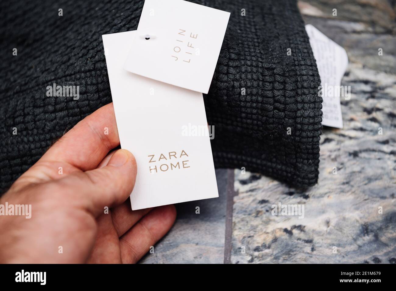 Paris, France - Dec 30, 2020: New luxury bathroom with male hand holding  the Zara Home floor textile rug on the luxury stone natural background  Stock Photo - Alamy