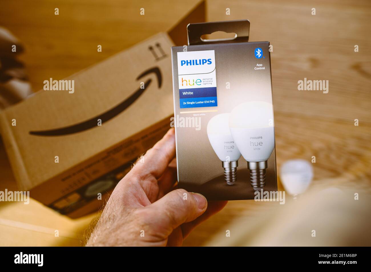 Paris, France - Dec 13, 2020: POV male hand holding after unboxing latest  Philips Hue Signify E14 white luster P45 bulbs with internet connectivity  Stock Photo - Alamy