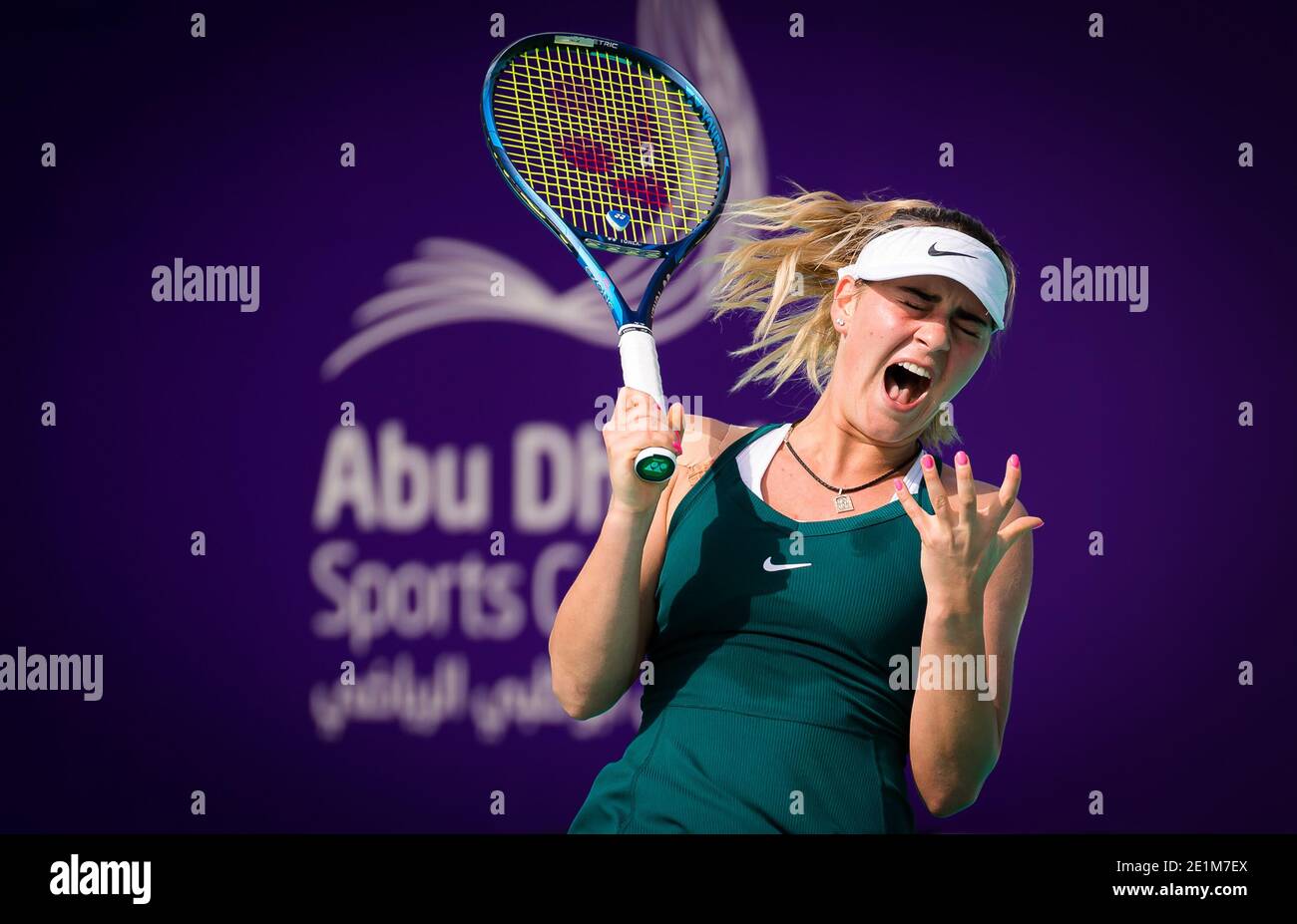 Marta Kostyuk of Ukraine in action against Lucie Hradecka of the Czech  Republic during the first round of the 2021 Abu Dhabi WTA Women's Tennis  Open WTA 500 tournament on January 7,