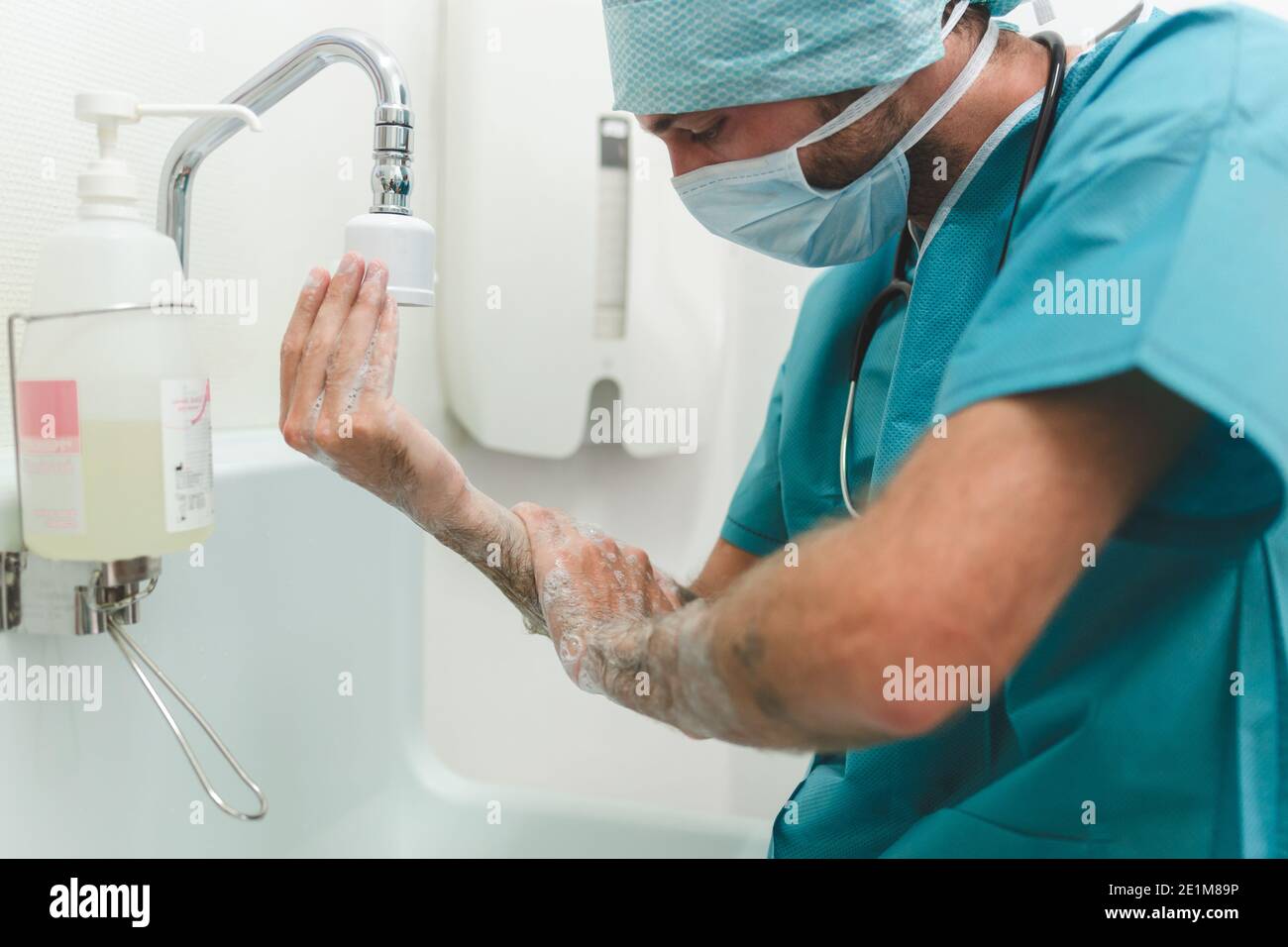 Surgeon or nurse washing hands before surgical intervention Stock Photo