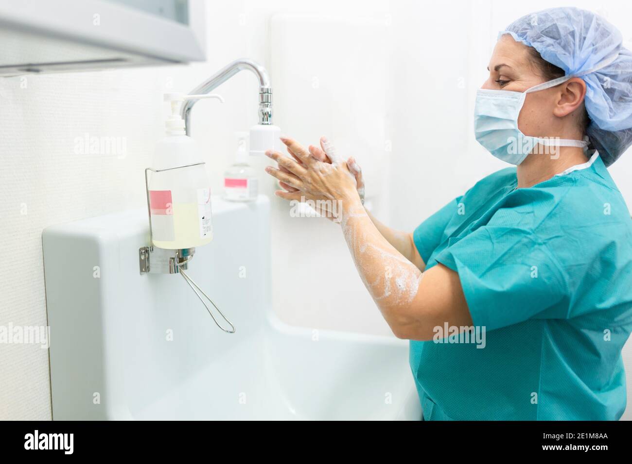 Surgeon or nurse washing hands before surgical intervention Stock Photo