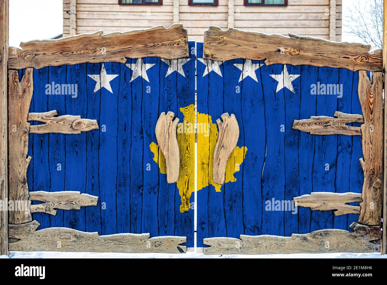 Close-up of the national flag of Kosovo on a wooden gate at the entrance to the closed territory. The concept of storage of goods, entry to a closed a Stock Photo