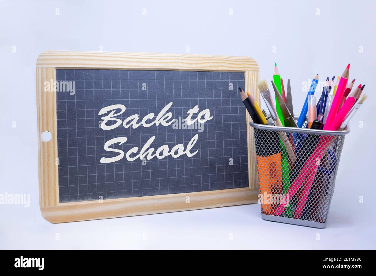 Colored chalk and eraser on wooden desk and chalkboard background Stock  Photo by formatoriginal