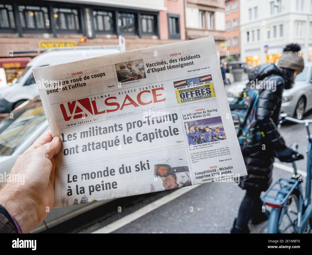 Paris, France - Jan 7, 2020: French newspaper L'Alsace front page headline show storming of the U.S. Capitol by supporters of U.S. President Donald Tr Stock Photo