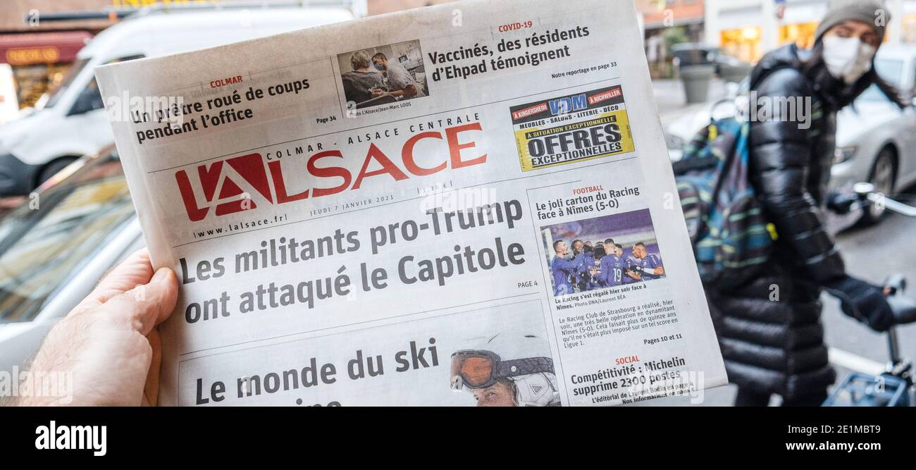 Paris, France - Jan 7, 2020: French newspaper l'Alsace front page show storming of the U.S. Capitol by supporters of U.S. President Donald Trump on Ja Stock Photo
