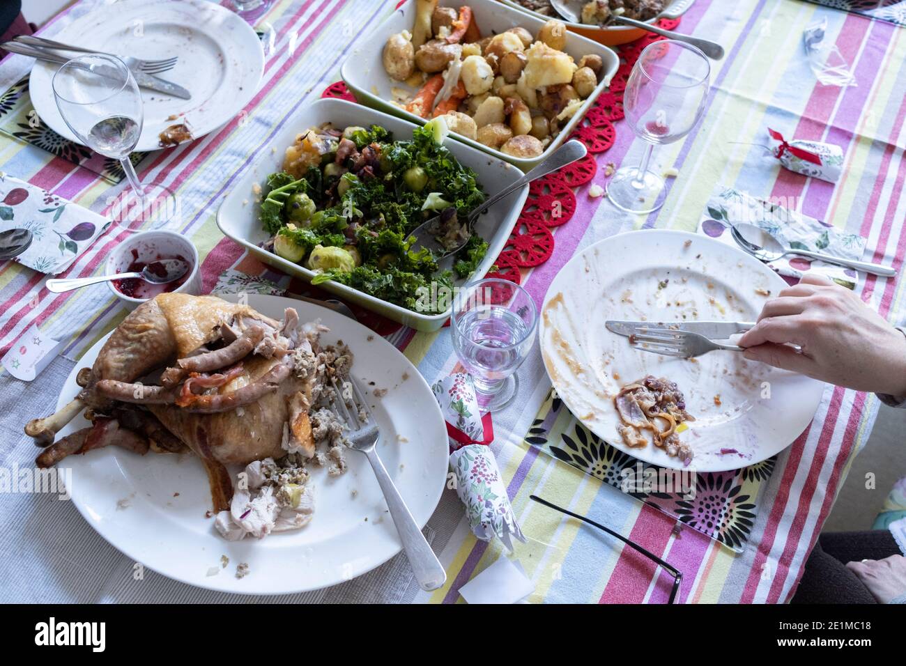 A table of food leftovers, the remnants of Christmas excess on Christmas Day, on 25th December 2020 in London, England. Stock Photo