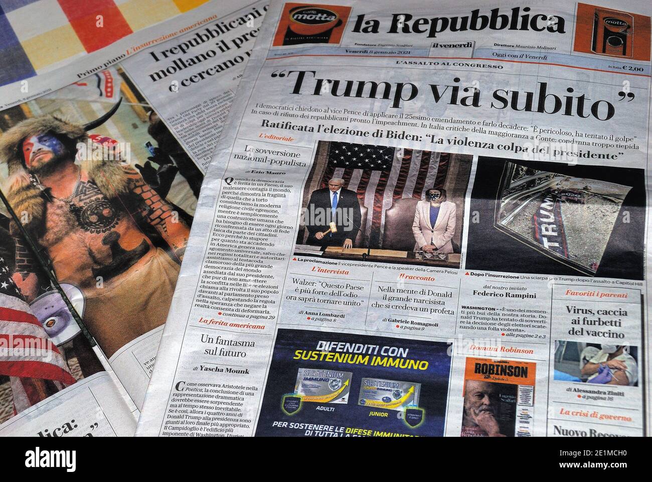 The authoritative Italian newspaper "La Repubblca" on the front page headlines Trump away immediately. Assault on Congress, coup d'état. The photos of the clashes and of Jake Angeli known as the shaman. Stock Photo