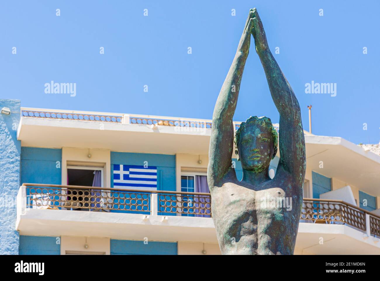 Statue of a naked diver along the waterfront of Pothia Town on the sponge fishing island of Kalymnos. Dodecanese, Greece Stock Photo