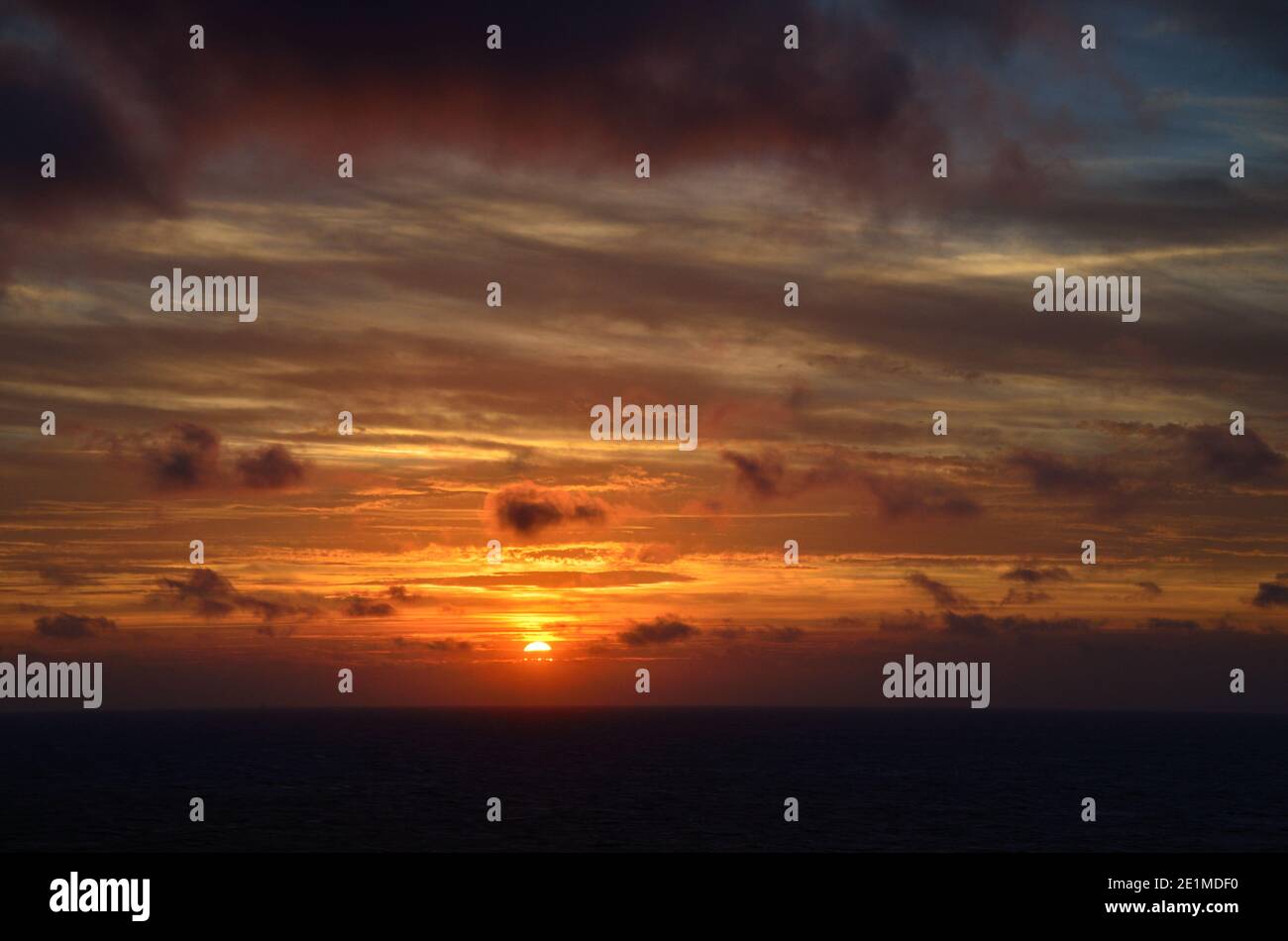 sunset with clouds on the cruise ship sea Stock Photo - Alamy