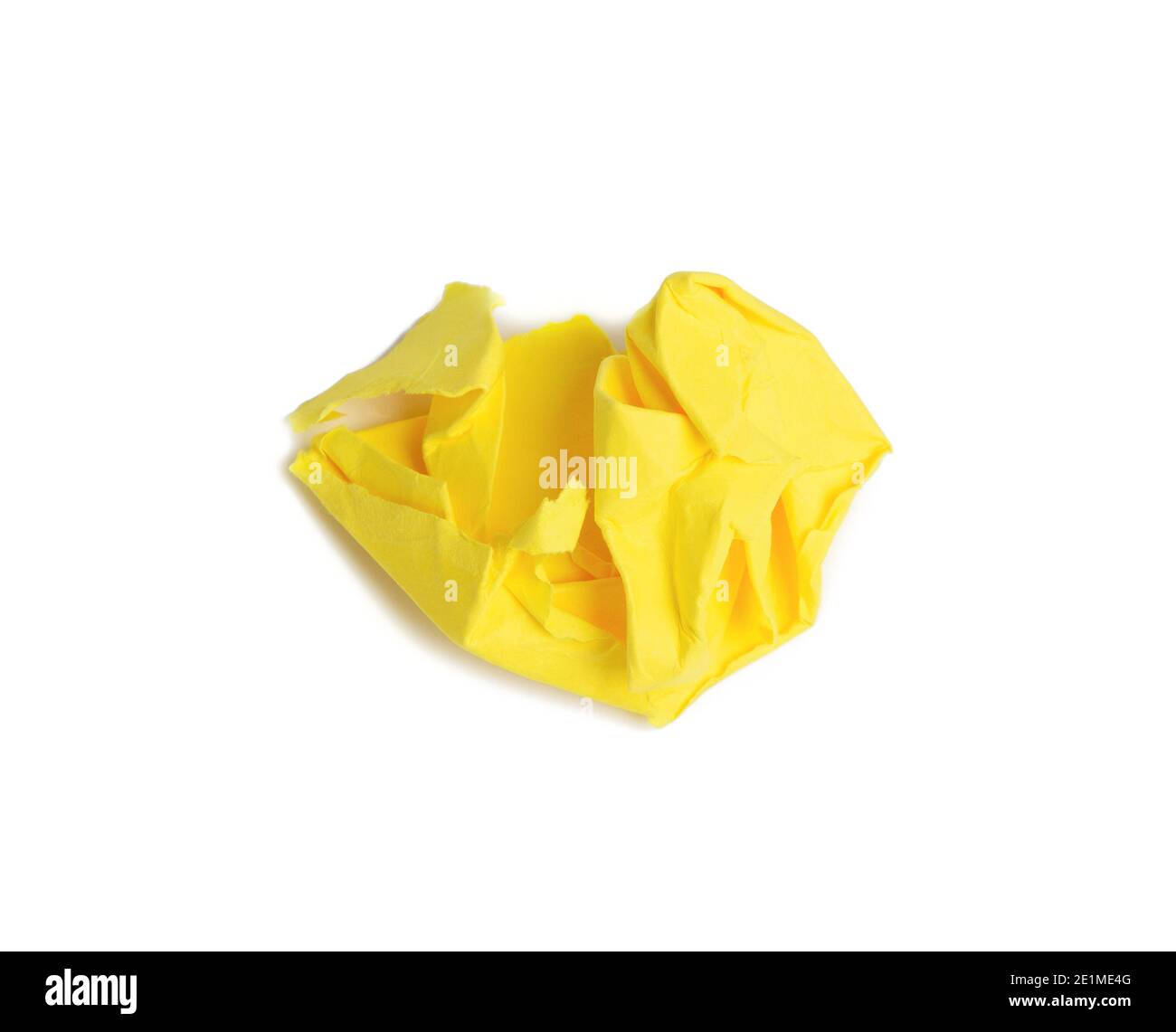 crumpled ball of brown sheet of yellow paper isolated on white