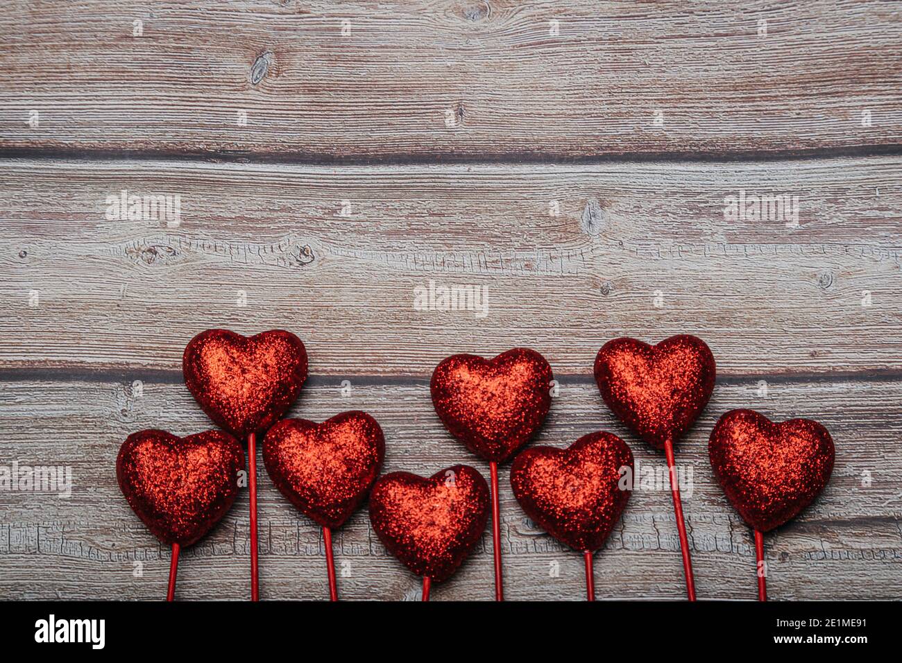 Valentine's day background with red hearts on an old dark wooden background.  Copy space Vintage style Stock Photo - Alamy, image size:1300x956