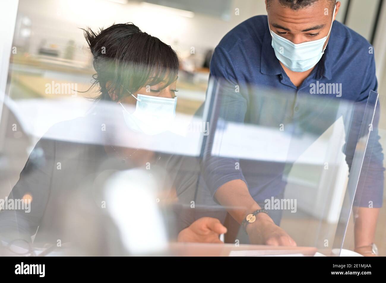 Start-up people working in co-working space office, wearing face mask during 19-ncov pandemic Stock Photo