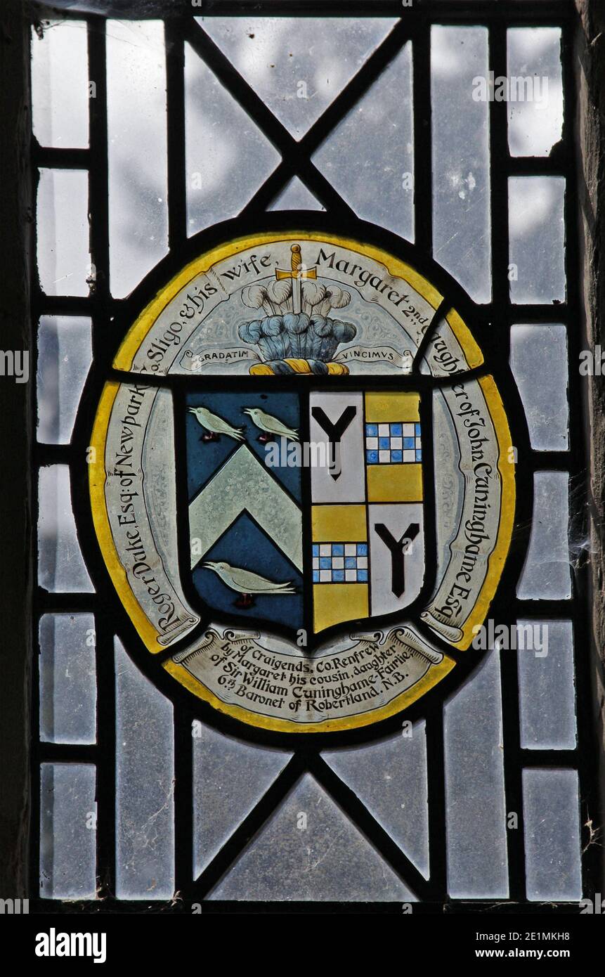 A stained glass window depicting the coats of arms of the Duke Family impaling Cunninghame, All Saints Church, Ladbroke, Warwickshire. Stock Photo