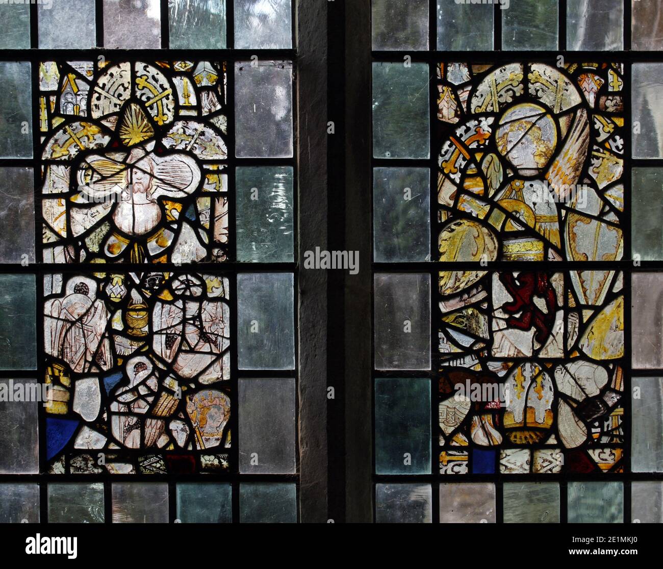 15th century stained glass fragments reassembled within plain quarries, Church of St Andrew, Letheringsett, Norfolk Stock Photo