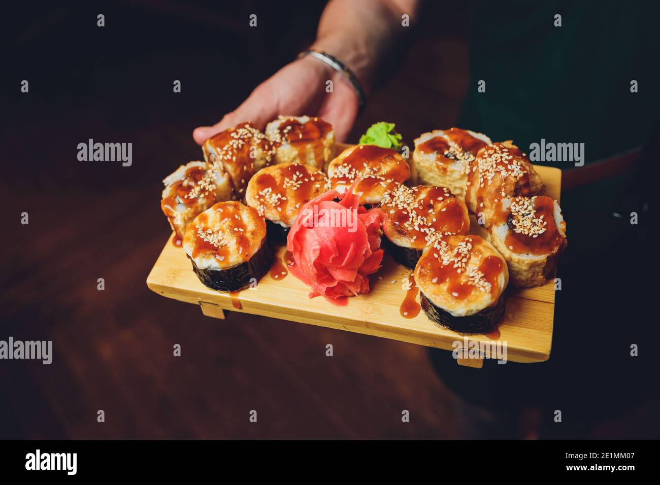 Asian food table with various kind of chinese food, noodles, chicken, pork,  beef, rice, spring rolls, sushi, prawns and many others. Served on old woo  Stock Photo - Alamy