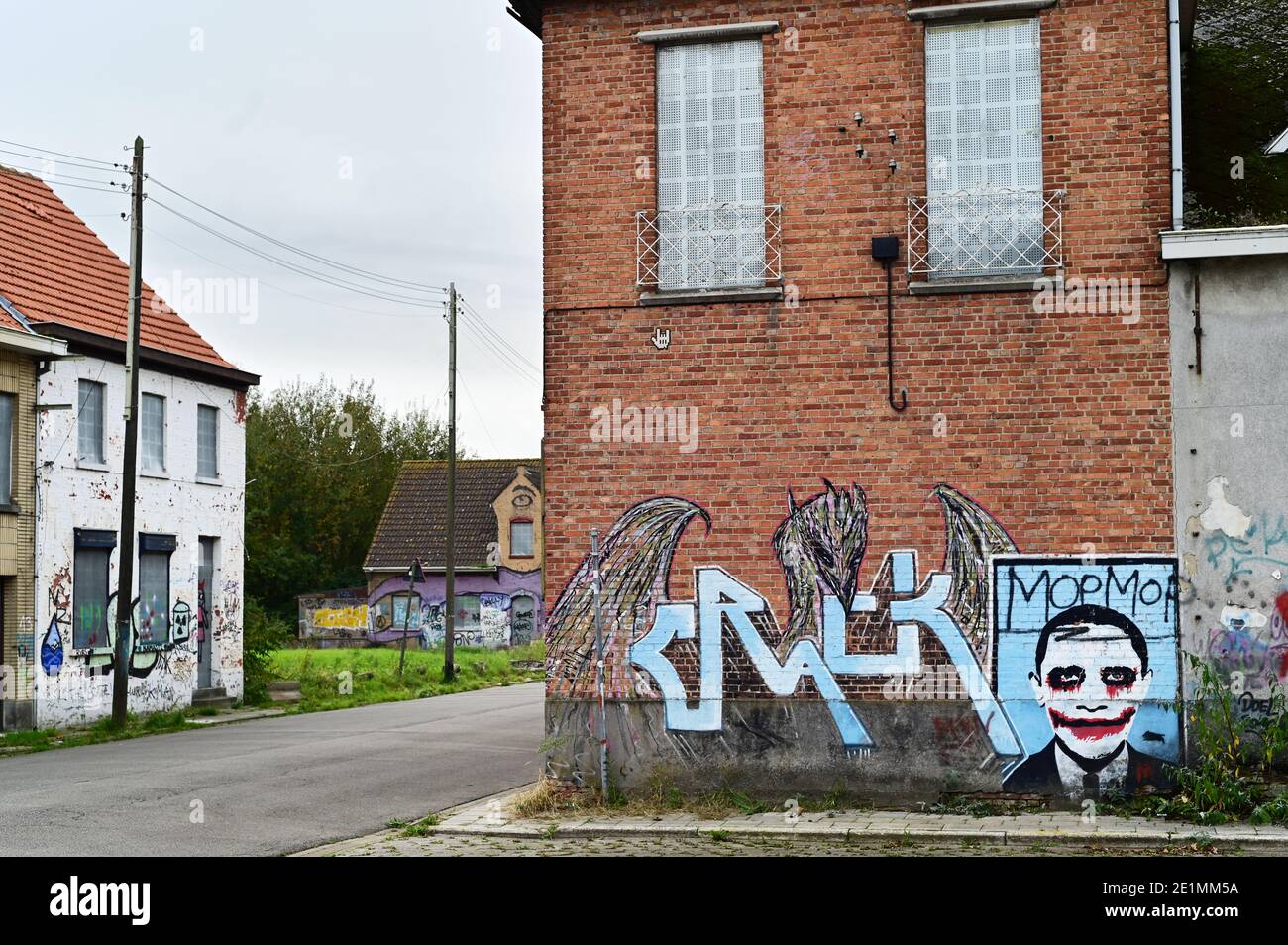 Boarded up homes covered with graffiti Stock Photo
