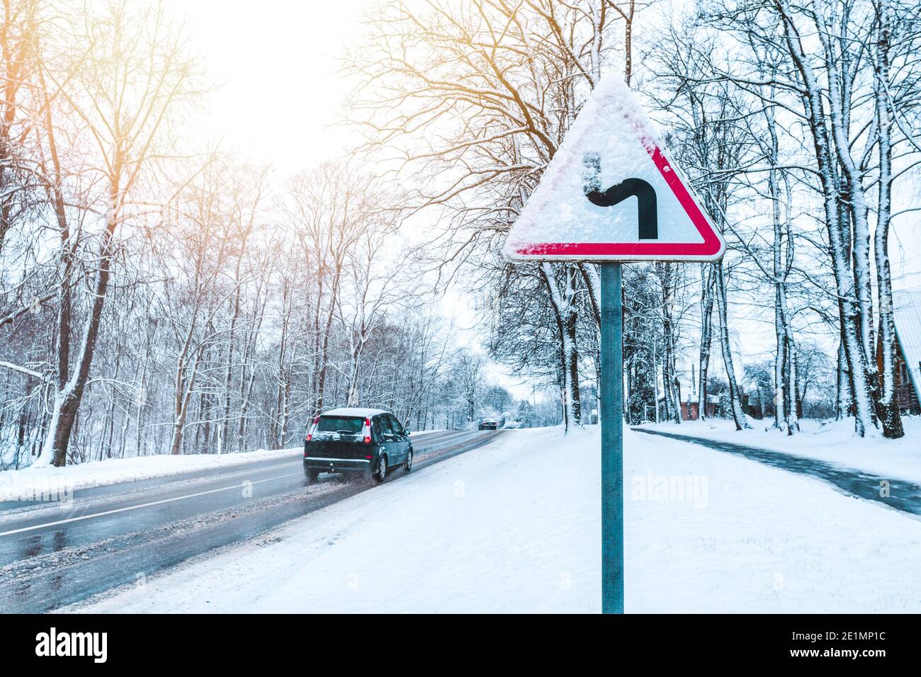 Winter Driving - Caution Snow - Curvy snowy country road Stock Photo ...